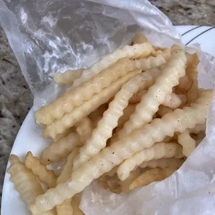 Raw, cold, wet fries.  We should have checked before we left with our to go order. Two orders of fries inedible.