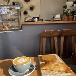 Vegan pumpkin bread, empanada and lavender oat cappuccino.
