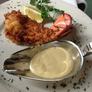 Fried lobster tail with a side of their lemon butter cream sauce