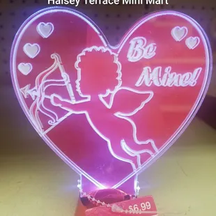 a heart shaped neon sign