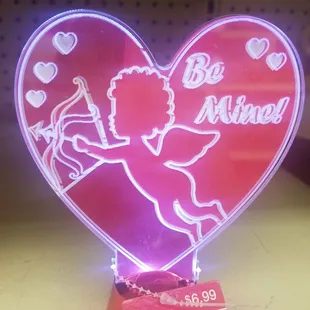 a heart shaped neon sign