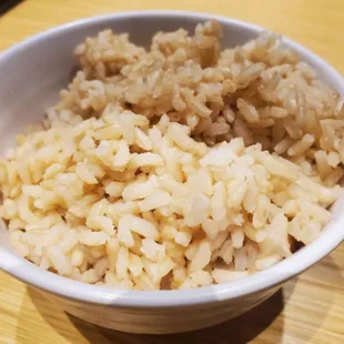  bowl of rice and a phone
