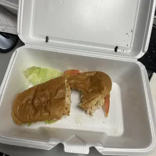 Grilled chicken sandwich on a tasteless hotdog bun