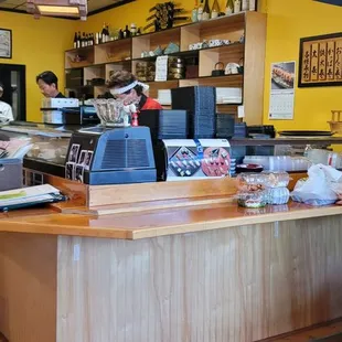 a woman standing at the counter