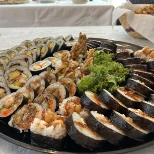 a platter of different types of sushi