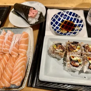 Salmon (4 pieces), salmon belly (4 pieces), tuna hand roll, and eel cut roll