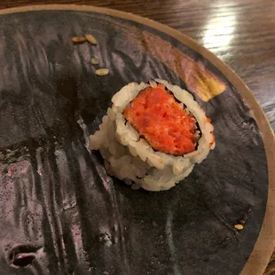 a piece of sushi on a plate