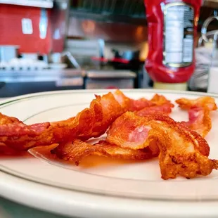 So close you can lick it! // Side of bacon.
