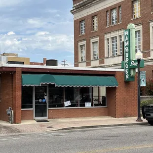 a truck parked in front of a restaurant