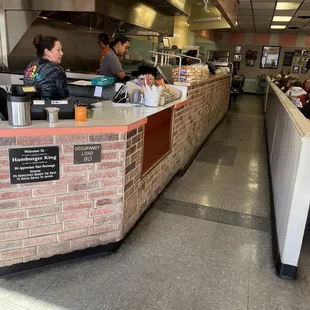 customers at the counter in the restaurant