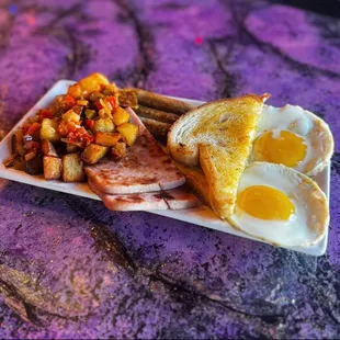 Breakfast of champions! 2 eggs any style, ham, buttery toast and crispy breakfast potatoes!