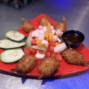a plate of fried shrimp and vegetables