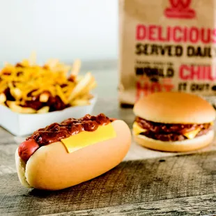 a hot dog with chili and cheese on a bun