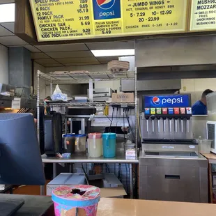 menus on the wall above the counter