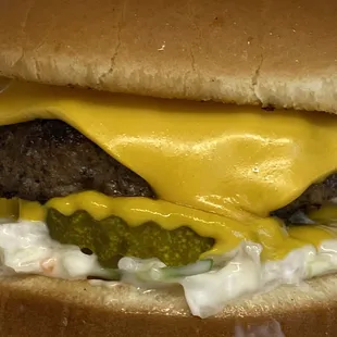 Slaw burger with cheddar cheese mustard pickle