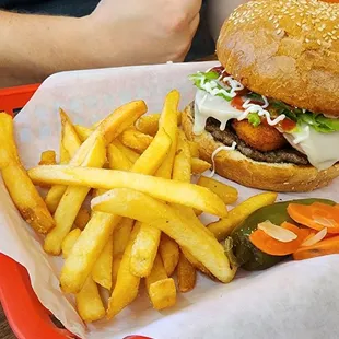 Burger with chicken nuggets and fries