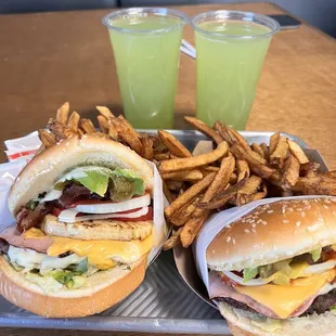 two hamburgers and fries