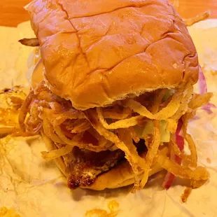 Grilled chicken sandwich with onions.