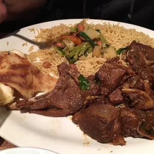 a plate of meat and rice