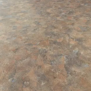 The table after wiping. The man as im aware just wiped it with the same towel he used to wipe the other tables. Not very sanitary.