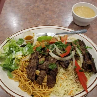 Soup, and steak with spaghetti and rice