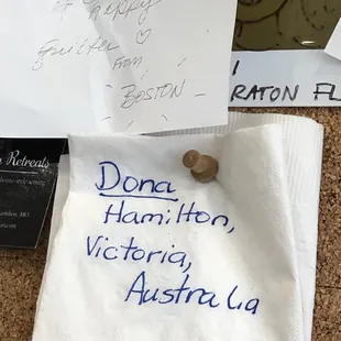 a corked note pinned to a bulletin board