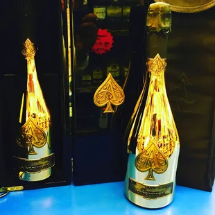 a bottle of champagne with playing cards on it