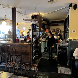 people sitting at tables in a restaurant