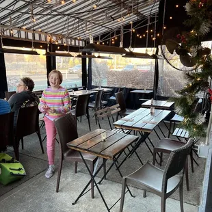 a little girl standing in a restaurant
