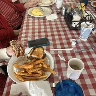 Patty melt with tomatoes, onions, and fries Senior ham and cheese omelette with one biscuit and gravy