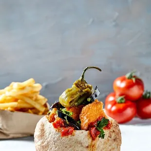 a baked bread with vegetables on top