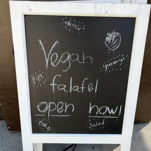 a chalk board with a sign that says,&apos;vegg is the fastest open now &apos;