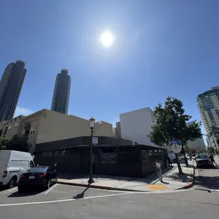 the sun shining over a city street