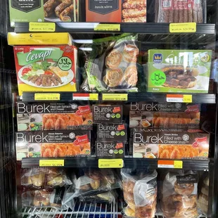 a display of meats and baked goods