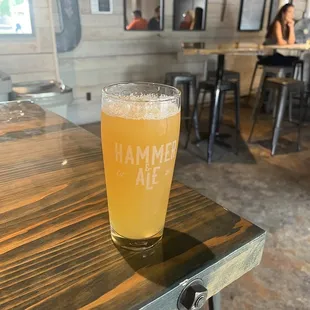 a glass of beer on a table