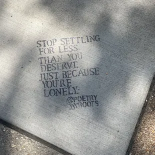 Outside in the sidewalk.  Wisdom.