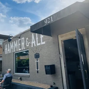 a man sitting outside of a building