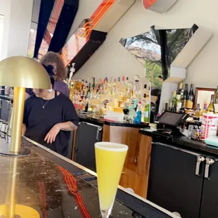 a woman sitting at a bar