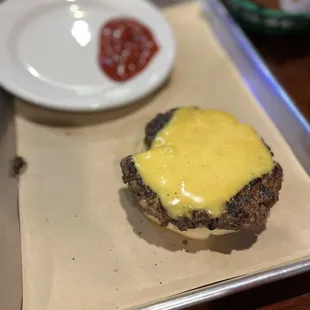 a cheeseburger and fries on a tray