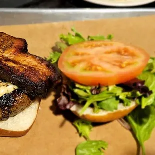 Elk burger with pork belly