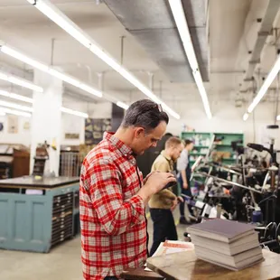 View the letterpress print production area from the store front. photo by Lance Flores