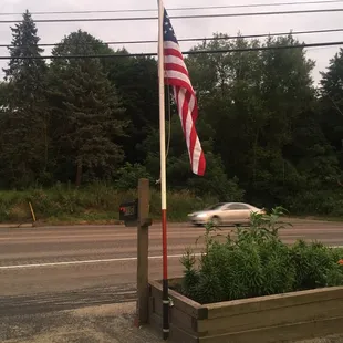 Love the Flag flying out front!