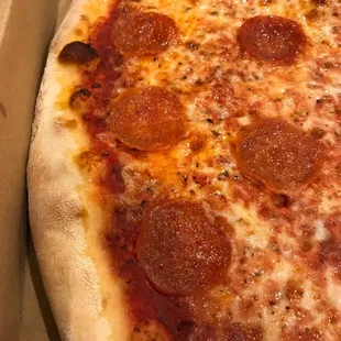 a pepperoni pizza in a box