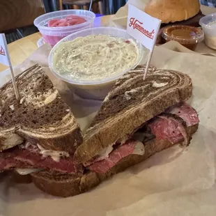 Pastrami Reuben sandwich, brisket sandwich and potato salad