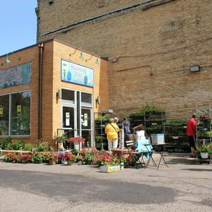 a group of people standing outside of a building