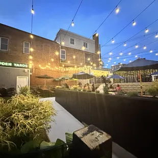 a patio area with tables and umbrellas