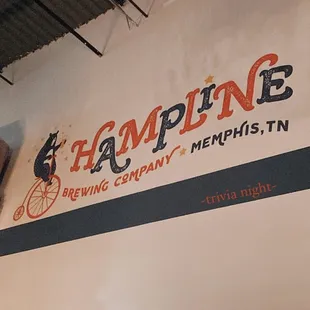 the logo on the wall