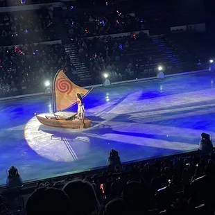 a man in a boat on a stage