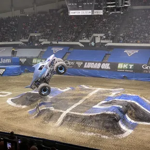 a monster truck doing a trick