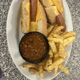 a plate of hot dogs and french fries